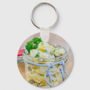 Potato salad in a jar on wooden key ring