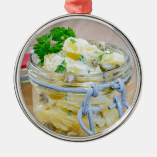 Potato salad in a jar on wooden metal tree decoration