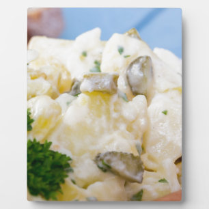 Potato salad with sausage and mustard plaque