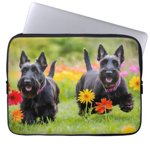 Prancing Scottish Terriers in grass and flowers Laptop Sleeve