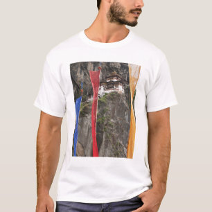 Prayer flags hang near Taktshang T-Shirt