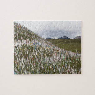 Prayer flags littering a hillside jigsaw puzzle