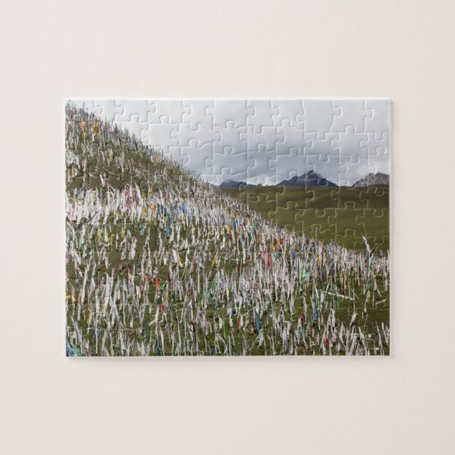 Prayer flags littering a hillside jigsaw puzzle (Horizontal)