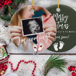 Pregnancy Merry Christmas baby ultrasound photo Ceramic Ornament<br><div class="desc">Modern funny I'm coming see your soon script,  footprints,  and red hearts new baby expecting keepsake Merry Christmas from mummy's tummy dark green tree ornament with your custom ultrasound photo.</div>
