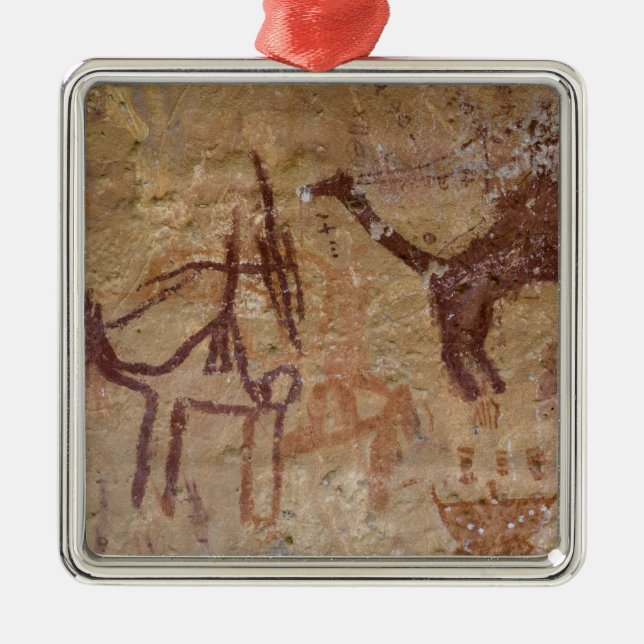 Prehistoric rock paintings with camels and metal ornament (Front)