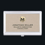 Premium Beige Linen Gold Monogram Business Card Holder<br><div class="desc">Show off your style and sophistication with this premium beige linen business card case featuring a luxurious gold monogram. Featuring a brushed gold monogram medallion with your name company and title in classic block typography, this case is a great way to keep your business cards organised and protected. The beige...</div>