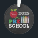 Preschool 2025 Chalkboard Name Ornament<br><div class="desc">Celebrate your little learner’s big year with this personalized “Preschool 2025” Christmas ornament! This round ceramic ornament features a colorful chalkboard-style design with a bright red apple, rainbow crayons, and bold lettering spelling out “PRE SCHOOL.” The standout feature? The apple is customizable with your child's name, making this keepsake extra...</div>