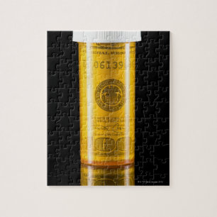 Prescription bottle with one hundred dollar bill jigsaw puzzle