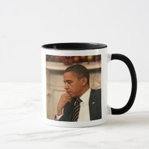 President Barack Obama reflects as he meets Mug
