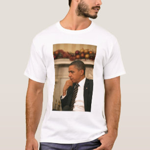 President Barack Obama reflects as he meets T-Shirt