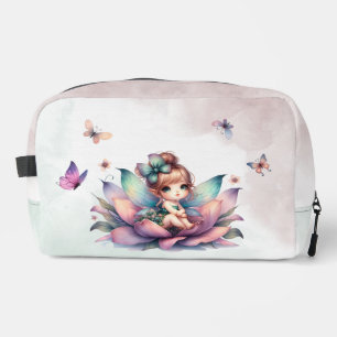 Pretty fairy sitting inside flower dopp kit