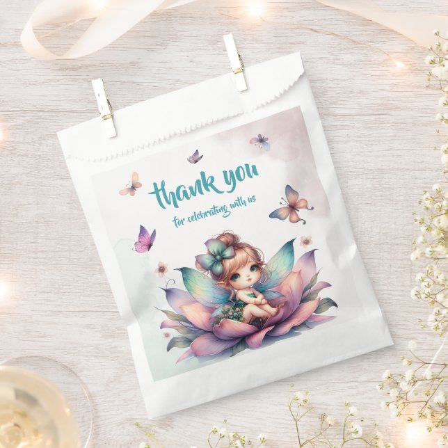 Pretty fairy sitting inside flower favour bag (Clipped)