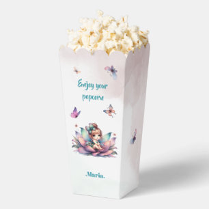 Pretty fairy sitting inside flower favour box