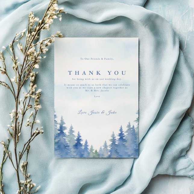 Pretty pine trees winter wedding table thank you card (Blue watercolor forest wedding thank you card with elegant script and pine tree border.)