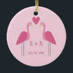 Pretty Pink Flamingo Cute Wedding Anniversary Gift Ceramic Ornament<br><div class="desc">Celebrate your first year as a newlywed couple with this cute,  commemorative Christmas ornament. This pretty pink gift features a simple drawing of two cute flamingo birds on either side of the couple's initials. Monogram with you and your wife's initials for a sweet and romantic present.</div>