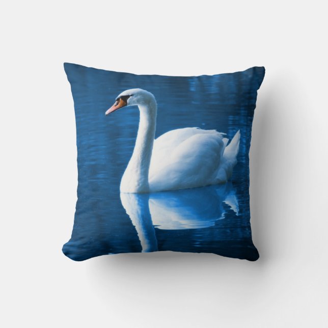 Pretty white swan floating on a blue lake cushion (Front)