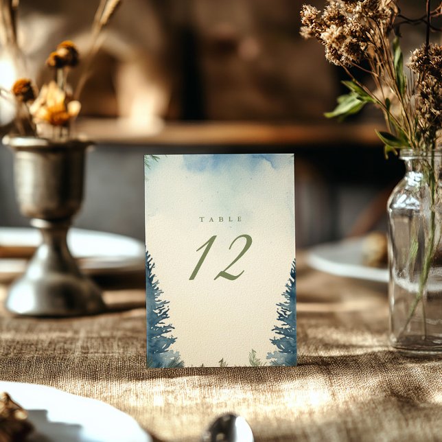 Pretty winter green pine trees table number (Blue and green winter pine trees wedding reception table number card)