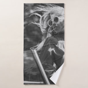 Pretty woman in convertible car bath towel