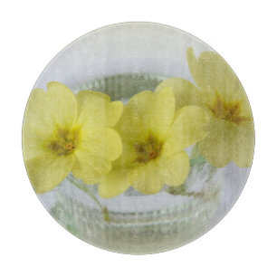 primrose in a coffee cup cutting board