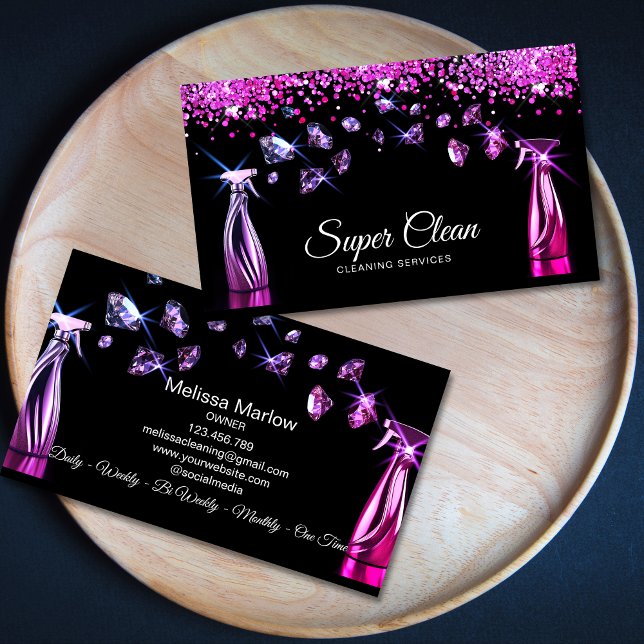 Professional House Cleaning Housekeeping Business Card (two rose gold house cleaning spray bottles spraying diamonds, black background, luxury feel)