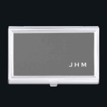 Professional Minimalist Grey Classic Monogram Business Card Holder<br><div class="desc">Professional business card holder features sleek minimalist design in a grey colour palette with white accents. Custom monogram initials presented on a simple grey background; positioned lower right hand corner. Shown with personalised monogram initials in a simple classic modern font, this executive business card holder is designed as a template...</div>
