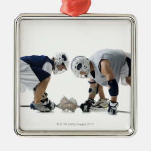 Profile of two young men playing lacrosse metal ornament