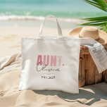 Promoted to Aunt EST 2025 | Personalised New Aunt Tote Bag<br><div class="desc">Celebrate a new aunt with this charming “Promoted to Aunt EST 2025” personalised tote bag! Designed in soft blush pink and modern script, this bag makes a thoughtful and practical gift for first-time aunts, baby showers, gender reveals, or pregnancy announcements. Perfect for carrying essentials, this natural cotton tote is lightweight,...</div>