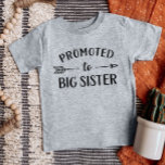 Promoted to Big Sister New Baby Announcement Baby T-Shirt<br><div class="desc">Custom printed apparel personalised with "Promoted to Big Sister" graphic in trendy modern fonts with a boho arrow design. Perfect for a pregnancy announcement photo or a gift for older siblings when new baby arrives! Use the design tools to edit the colours or add your own text and photos to...</div>