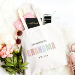 Promoted to Grandma EST 2025 | Pastel Gift Tote Bag<br><div class="desc">Celebrate the sweetest promotion ever with this minimalist "Promoted to Grandma EST 2025" personalised tote bag! Featuring soft pastel lettering and a clean, modern design, this reusable cotton tote is perfect for grocery runs, baby visits, or simply showing off that exciting new grandma status. Customise the year or name for...</div>