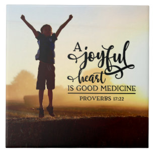 Proverbs 17:22 A cheerful heart is good medicine Ceramic Tile