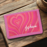Psychedelic Hearts Calligraphy Script Name Pinks Trifold Wallet<br><div class="desc">A funky heart pattern with pastel pinks and reds. The modern script adds a funky, modern touch to this retro design. Add your name or delete the text for a fun girly design. The name is a trendy script in a large white size. If you click on the customise link,...</div>