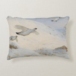 Ptarmigan in winter plumage,flying across the snow decorative cushion