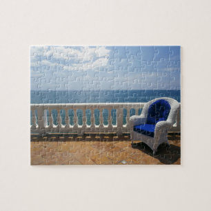 Puerto Rico. Wicker chair and tiled terrace at Jigsaw Puzzle