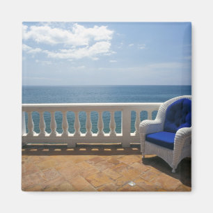 Puerto Rico. Wicker chair and tiled terrace at Magnet