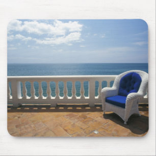 Puerto Rico. Wicker chair and tiled terrace at Mouse Pad