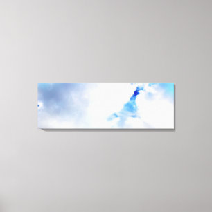 Puffy White Clouds and Blue Sky Canvas Print