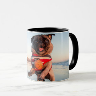 Pug Playing Ball on Beach Mug