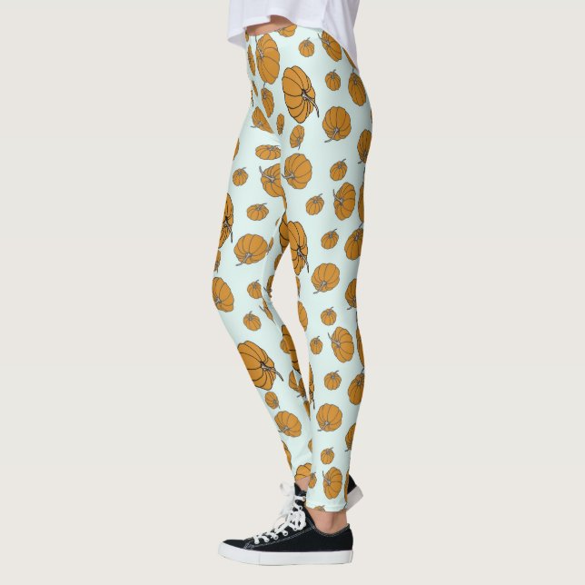 Pumpkin surface pattern design on aqua background leggings (Left)