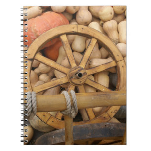 Pumpkins and Wheel of the rural wooden cart Notebook