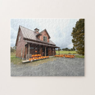 Pumpkins by a small farm building jigsaw puzzle