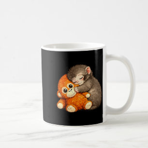 Punch the monkey cuddling stuffed animal meme coffee mug