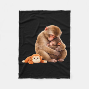 Punch the monkey cuddling stuffed animal meme fleece blanket