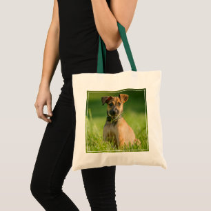 Puppy In The Grass Tote Bag
