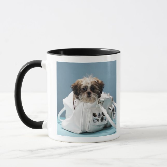 Puppy sitting in handbag mug (Left)