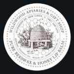 Pure Honey and Beeswax Lip Balm Vintage Skep  Classic Round Sticker<br><div class="desc">Custom Lip Balm label with vintage illustration of a bee-hive surrounded by an old world garden with wildflowers,  and little bees. Dotted circle border. Honeycomb Pattern in background. Personalise with your name,  apiary,  location,  cell number,  and ingredient list.</div>