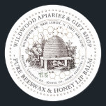 Pure Honey and Beeswax Lip Balm Vintage Skep  Classic Round Sticker<br><div class="desc">Custom Lip Balm label with vintage illustration of a bee-hive surrounded by an old world garden with wildflowers,  and little bees. Dotted circle border. Honeycomb Pattern in background. Personalise with your name,  apiary,  location,  cell number,  and ingredient list.</div>