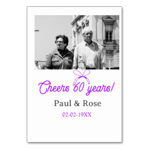 Purple bow cheers to 60 years anniversary wedding table number
