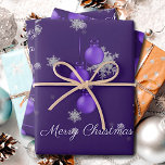 Purple Christmas Ornaments Wrapping Paper Sheets<br><div class="desc">Wrap gifts for under the Christmas tree this holiday season with Purple Christmas Ornaments Wrapping Paper.  Wrapping paper design features a trio of hanging Christmas ornaments with falling snowflakes and a dark purple background. Additional gift and holiday items available with this design as well.</div>