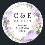 Purple Floral Monogrammed Wedding Thank You Classic Round Sticker<br><div class="desc">Purple roses and white flowers are nestled in buds and greenery to create a romantic wreath. Your couple's initials, wedding date and thank you statement are in the centre. Perfect seal for your thank you notes or wedding favours. It is part of the Violette collection that contains many DIY templates...</div>