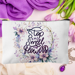 Purple floral stop and smell the flowers accessory pouch